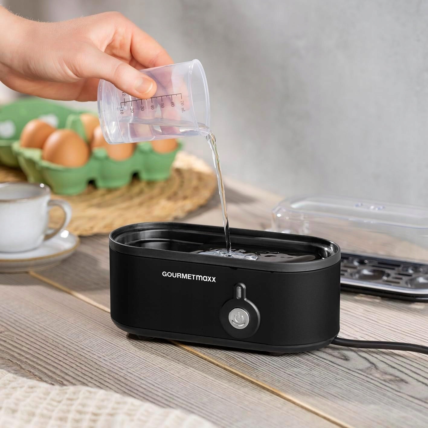 EGG COOKER FOR 3 EGGS EGG PUNCHER AND MEASURING CUP 3 DEGREES OF HARDNESS Dominant color black