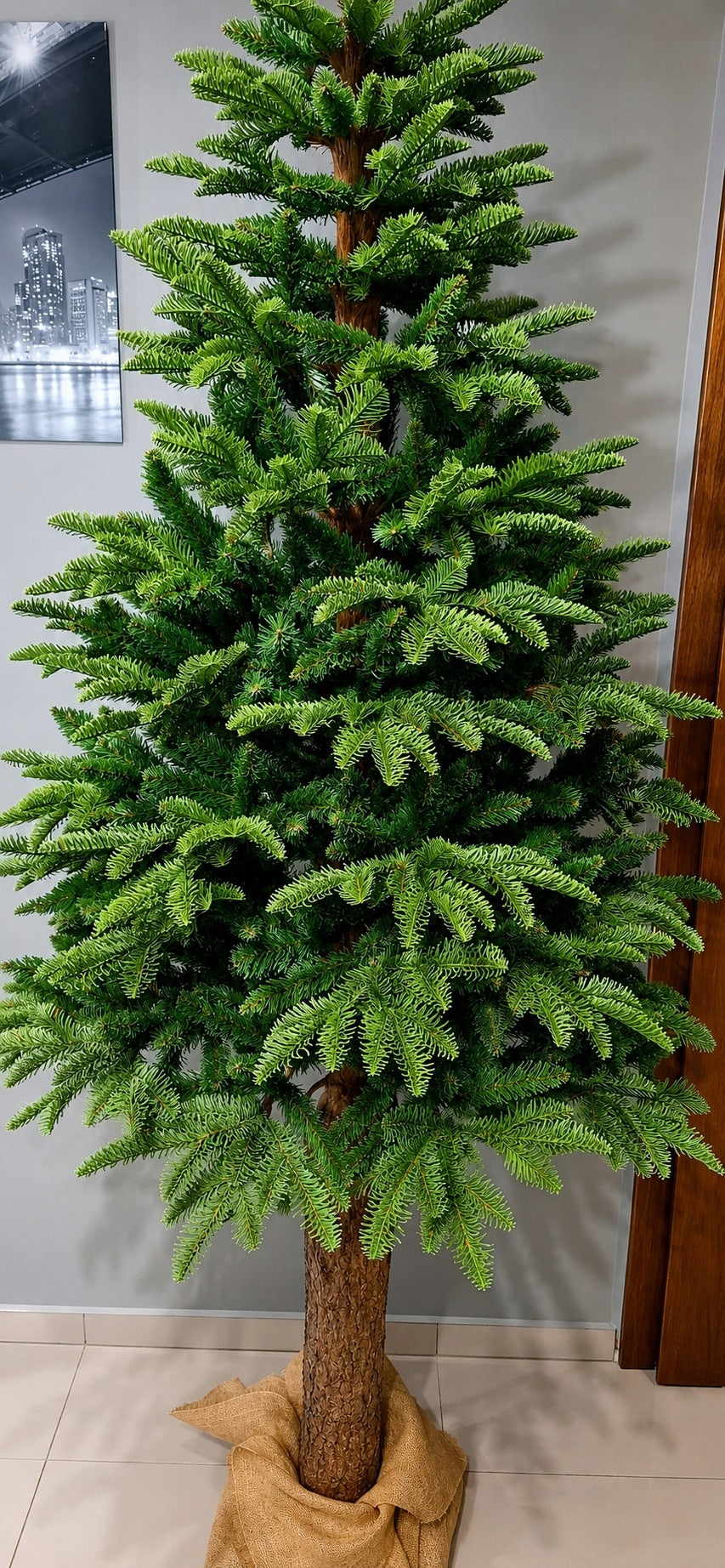 Beautiful artificial Christmas tree on the trunk of Fir Noble as a living PE 220 cm Packaging status original