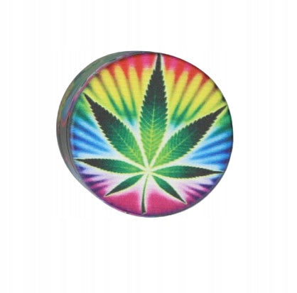 Grinder Tobacco Grinder with Green Marijuana Leaves on Colorful Background