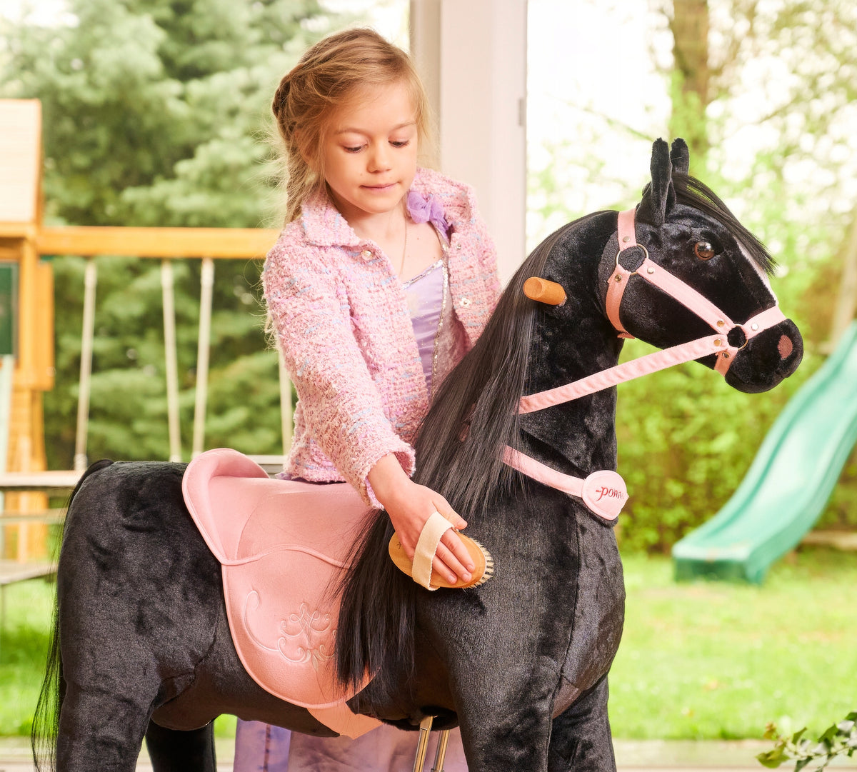 Horse on wheels Ponnie Ebony M with a pink saddle Manufacturer code H404P