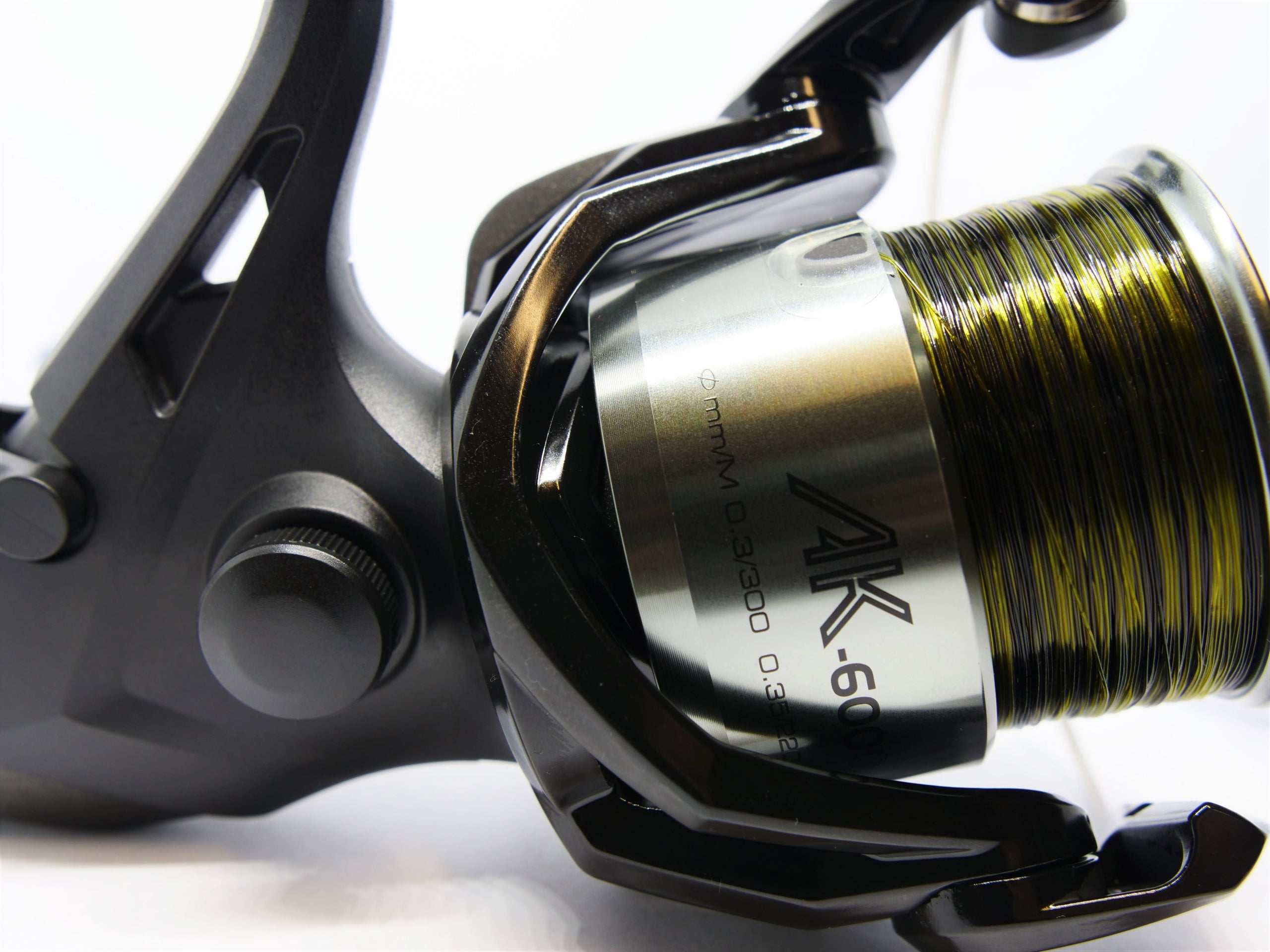 Reel Okuma AK 6000 Baitfeeder with wound line Manufacturer code 64277