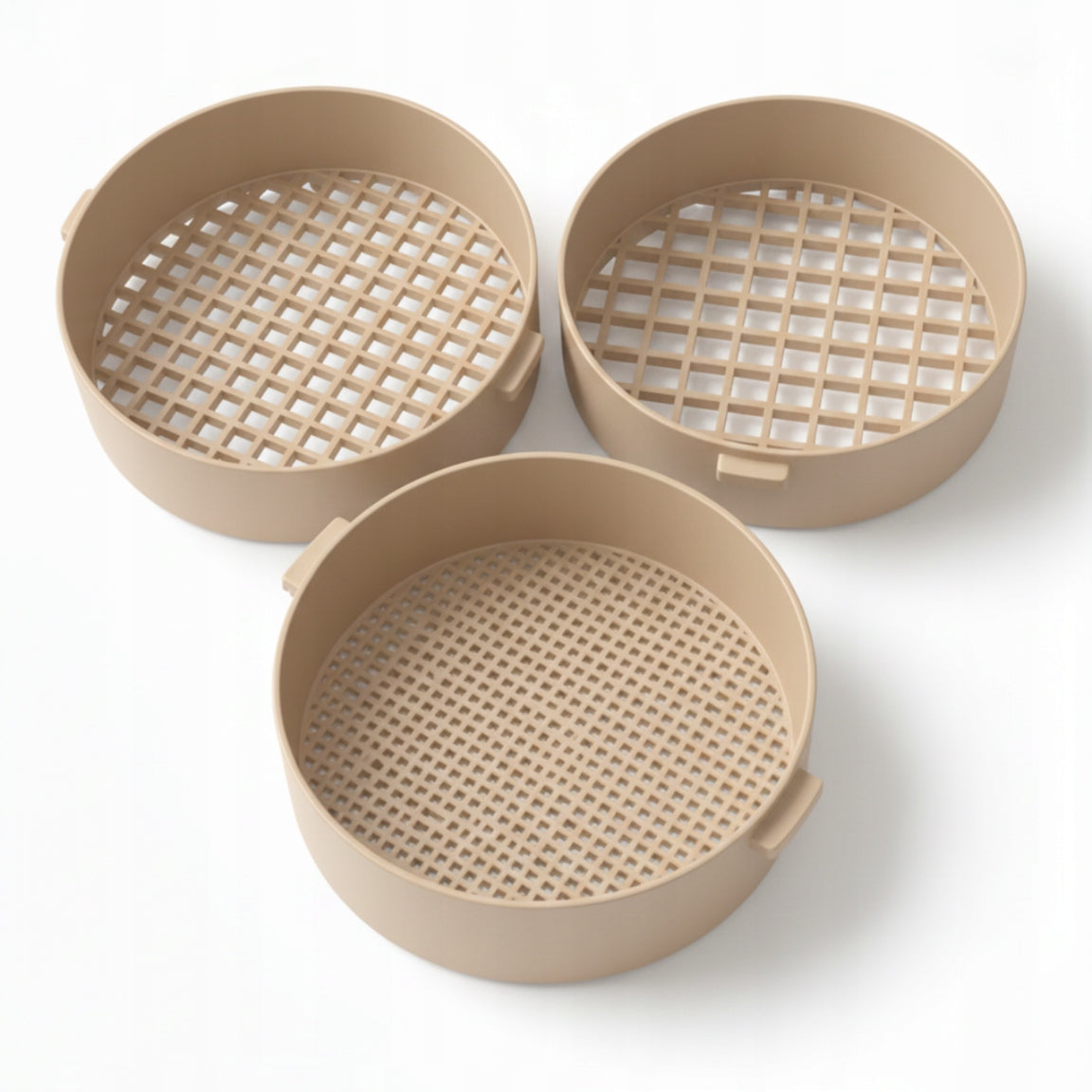 Set of beige strainers for sifting sand on the beach for children