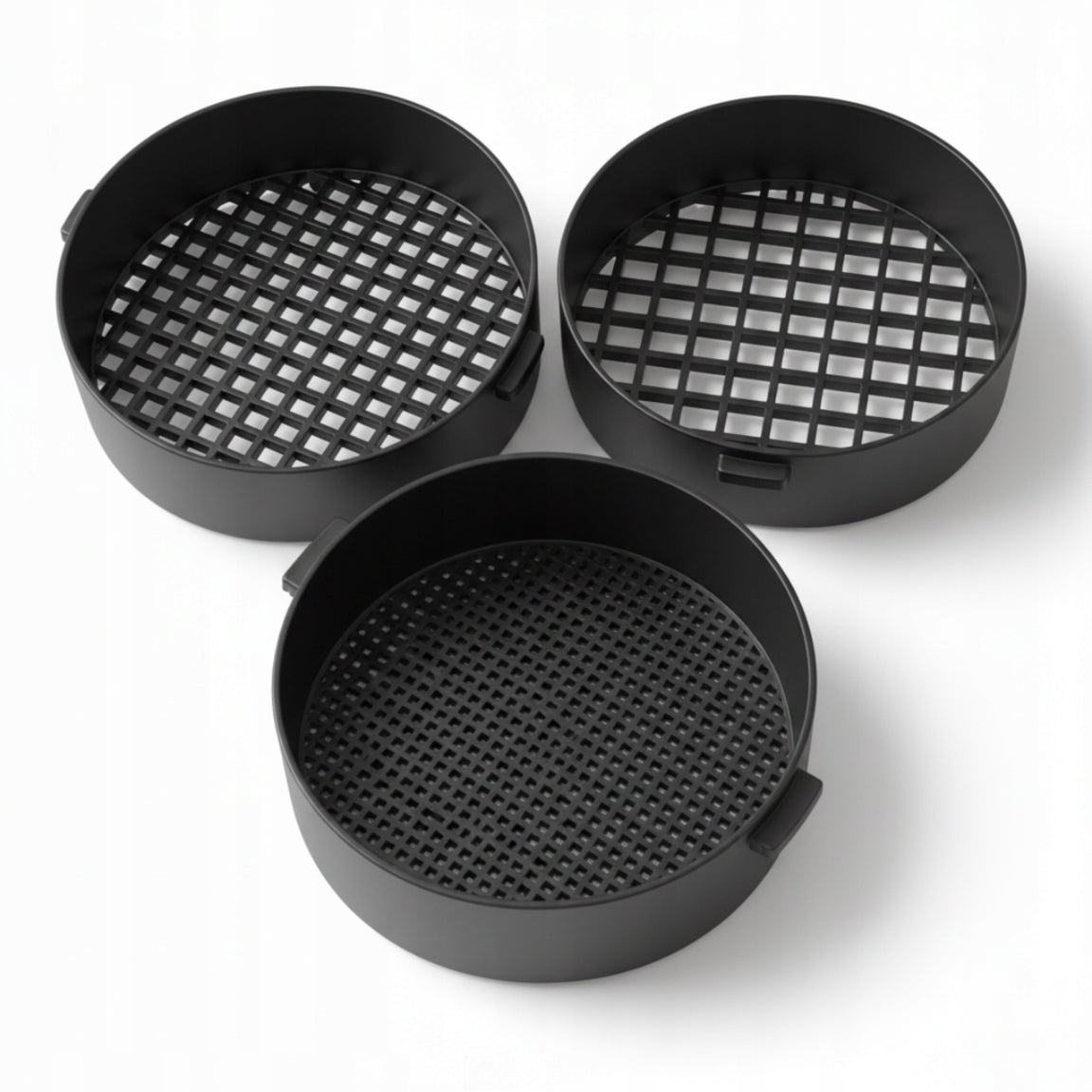 Set of black strainers for sifting sand on the beach for children
